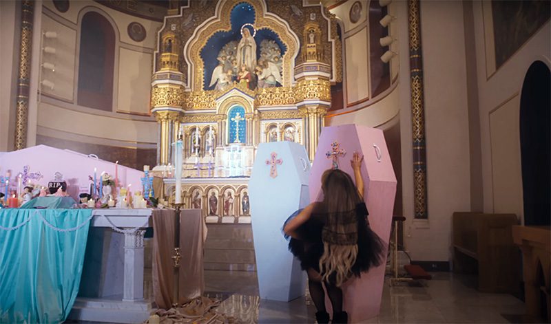 feather12 Sabrina Carpenter Desecrates an Actual Church in Her Highly Toxic Video 
