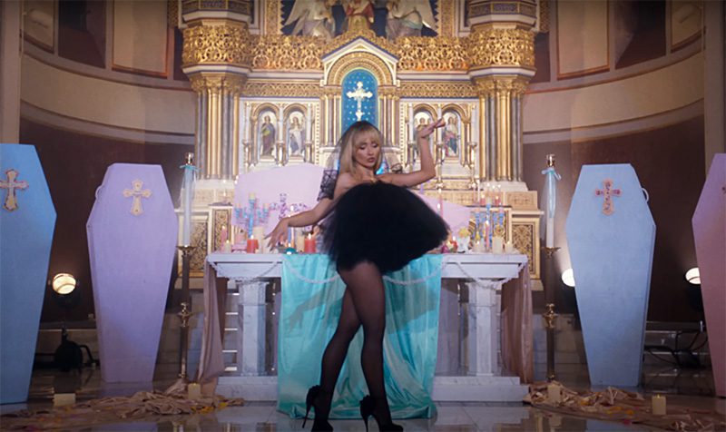 feather3 Sabrina Carpenter Desecrates an Actual Church in Her Highly Toxic Video 
